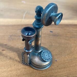 Tiny metal vintage phone shaped pencil sharpener